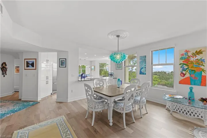 Dining space with light hardwood / wood-style floors