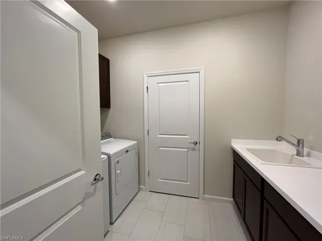 Large Laundry Room with Sink and Storage