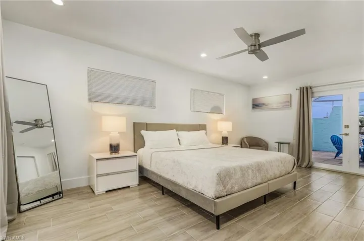 Bedroom featuring recessed lighting, access to outside, french doors, ceiling fan, and wood tiled floors