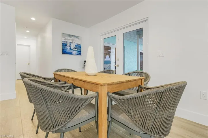 Dining area with recessed lighting and french doors