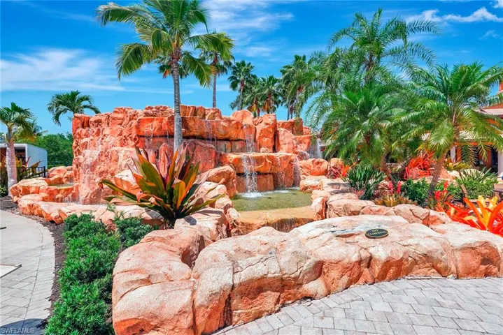 Community sign with a garden pond