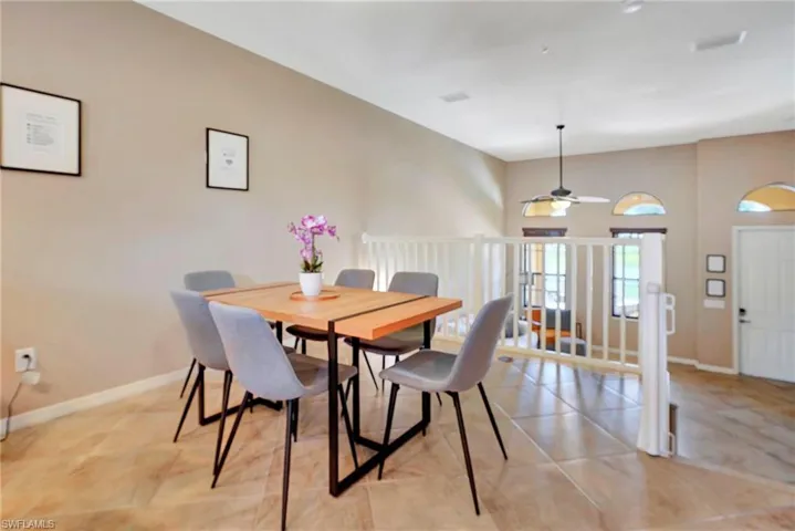 Dining room featuring a ceiling fan and light tile patterned floors
