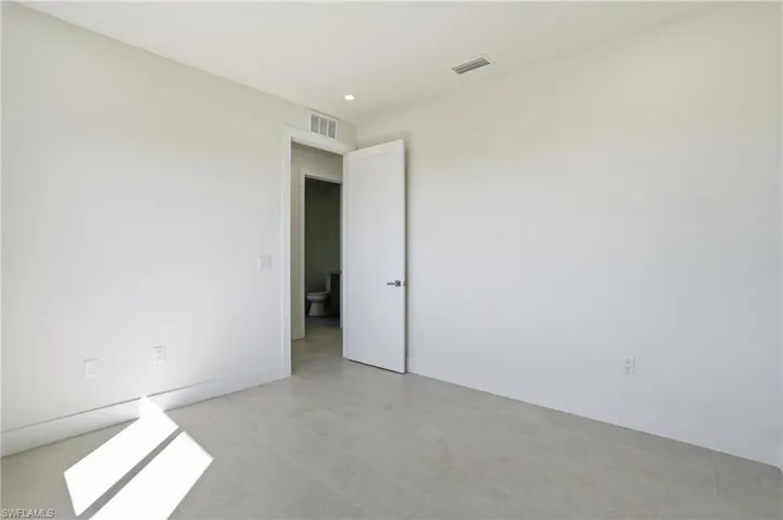 Bedroom with baseboards and recessed lighting