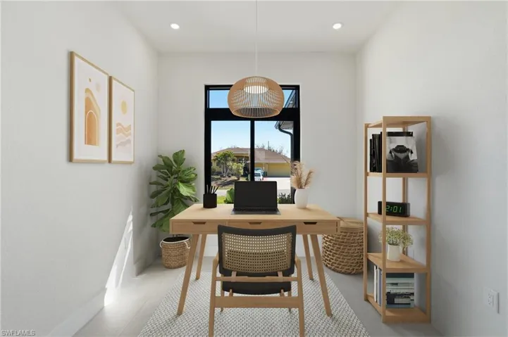 Office space with recessed lighting and baseboards