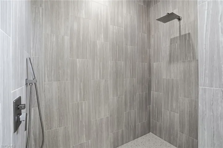 Full bathroom with tiled shower