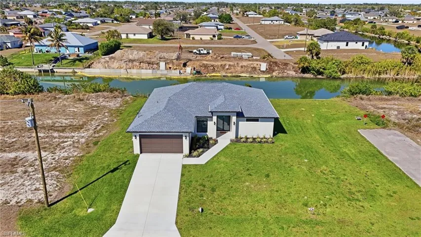 Aerial view of residential area with a nearby body of water