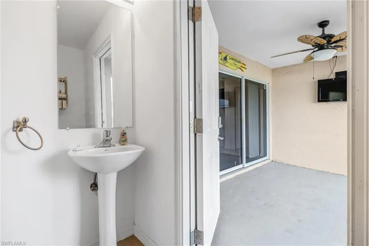 Bathroom with ceiling fan and concrete flooring