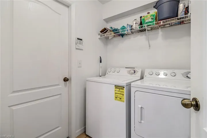 Clothes washing area with washer and clothes dryer