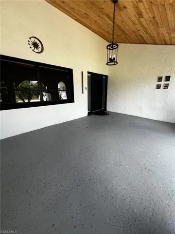 Doorway to property with stucco siding and a patio