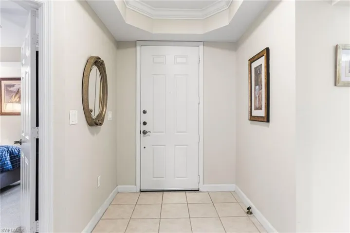 A lovely foyer welcomes you into the residence, highlighted by an elegant tray ceiling at the entrance that sets a refined and inviting tone from the moment you arrive.