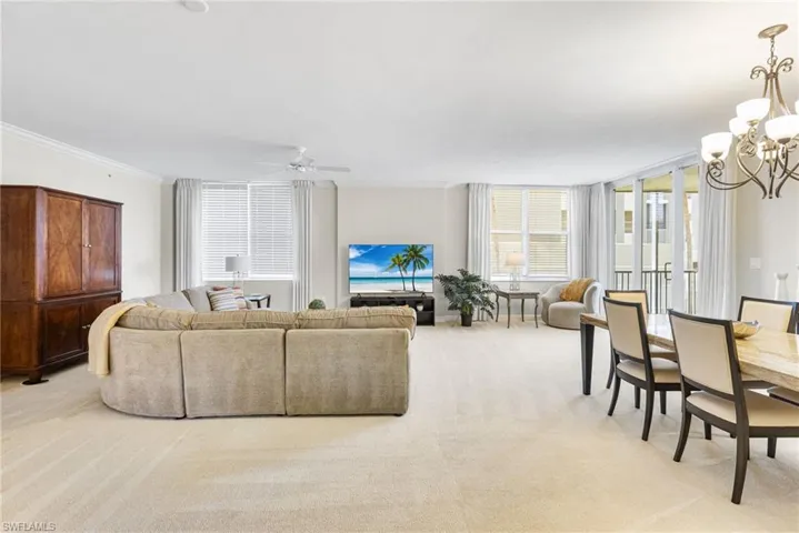 Abundant natural light pours into the expansive main living area, creating a bright and airy ambiance throughout. From here, you are seamlessly connected to the lanai, where sweeping views of the river provide a serene and picturesque backdrop for everyday living and effortless entertaining.