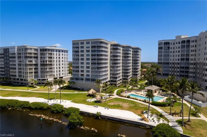 The Shores community delivers an elevated resort-style experience, featuring inviting tiki lounge areas and a private beach that embody relaxed sophistication and coastal luxury. Perfectly positioned at the mouth of the marina, the setting offers a front-row seat to watch boats glide gracefully in and out, creating a serene and captivating way to begin or end each day immersed in the Southwest Florida lifestyle.