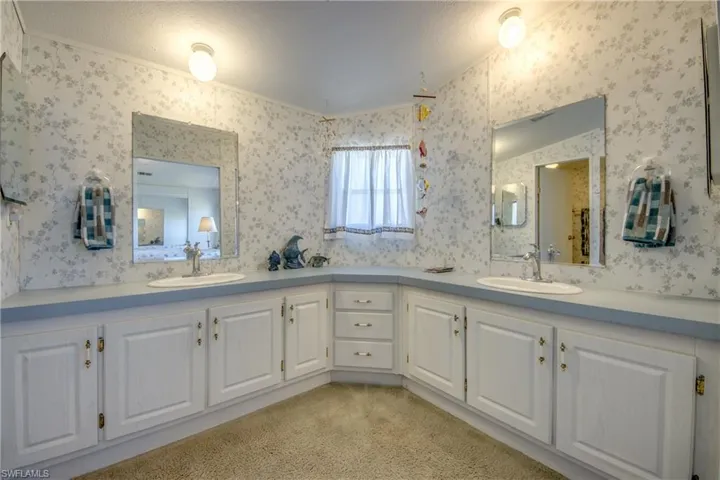 Bathroom with vanity and a textured ceiling
