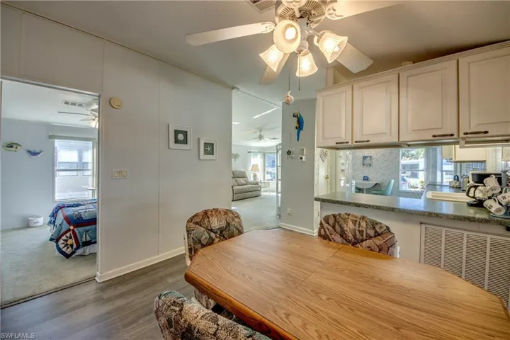 Dining room with dark hardwood / wood-style flooring