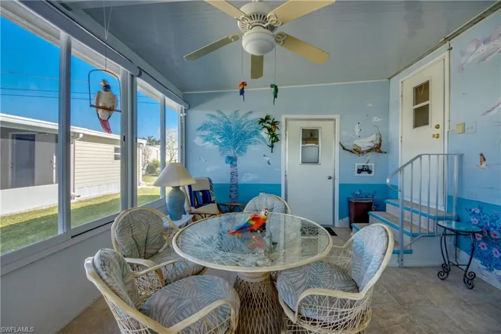 Sunroom / solarium with ceiling fan and a healthy amount of sunlight