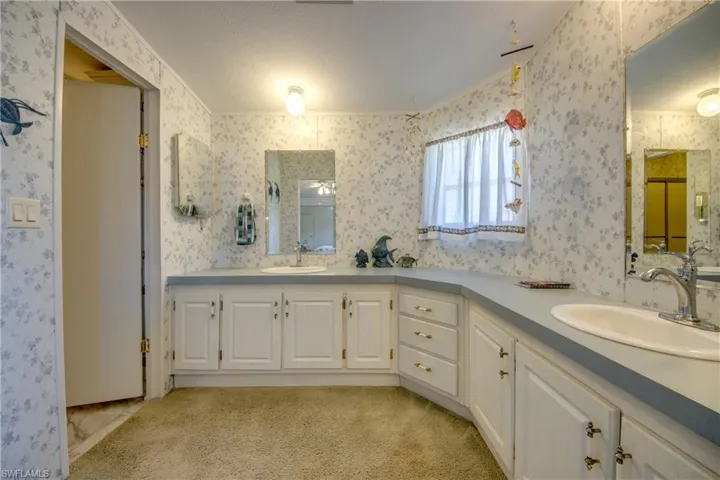 Bathroom with vanity and a textured ceiling