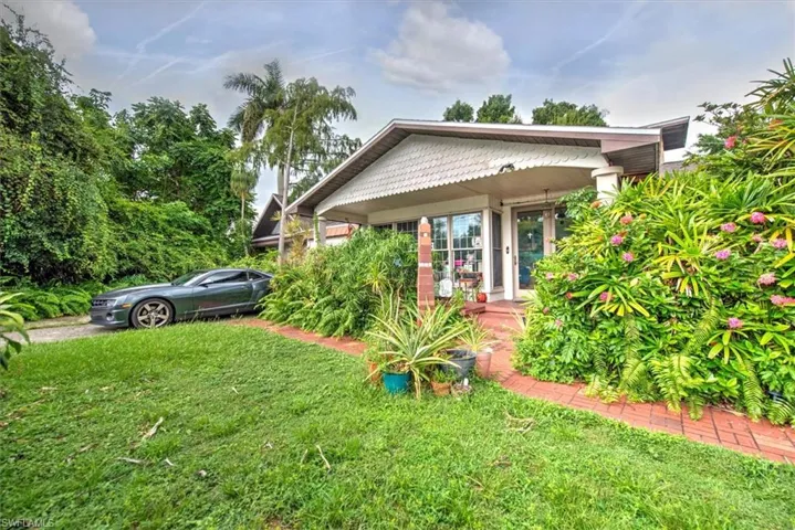 View of front of house with a front yard