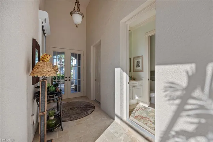 Foyer entrance featuring french doors