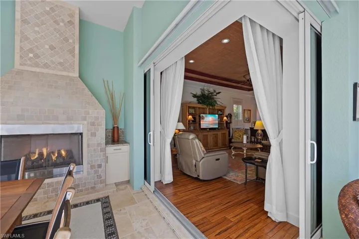Living room featuring a tiled fireplace