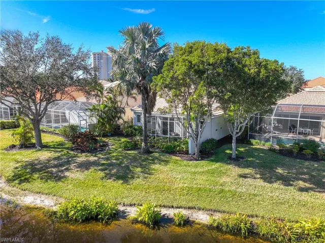 View of backyard with a lanai