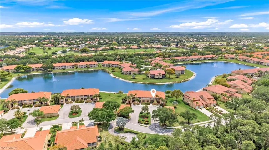 Aerial perspective of suburban area with a nearby body of water