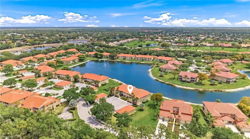 Aerial perspective of suburban area with a nearby body of water