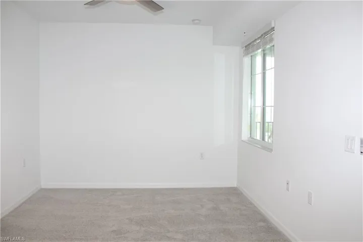 Master Bedroom room featuring carpet flooring, ceiling fan, baseboards, and a smoke detector