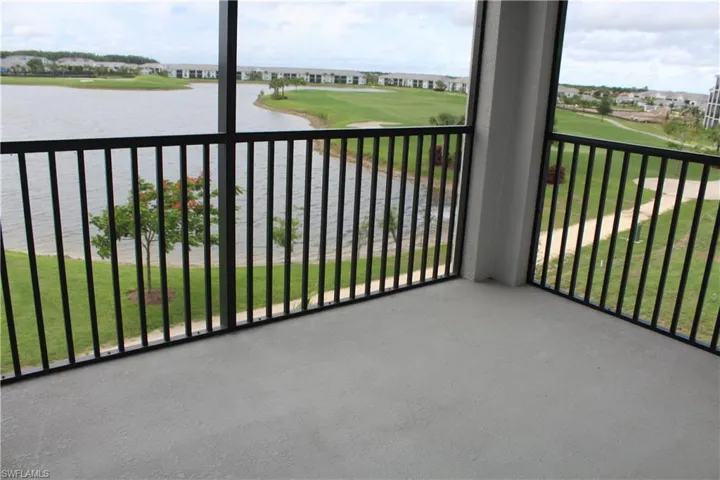 Balcony featuring a water view and golf course view
