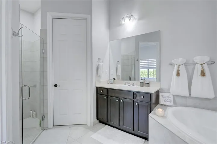 Corner walk in shower with glass enclosure