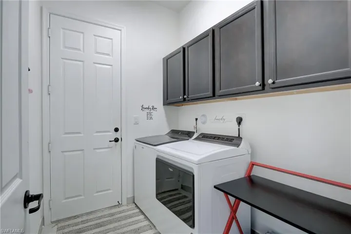 Spacious laundry room/mud room leads to garage.