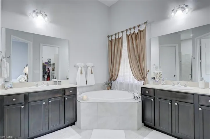 Master bath with soaking tub and large split vanities