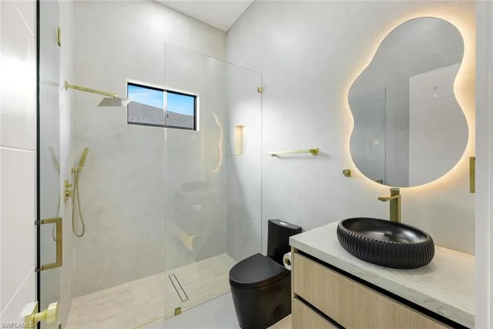 Bathroom with vanity and a walk in shower