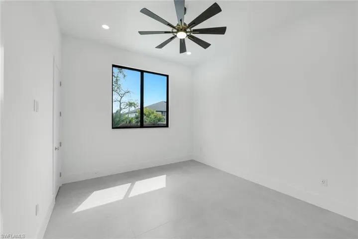 Unfurnished room with ceiling fan, recessed lighting, and concrete flooring