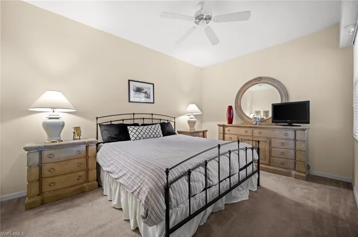 Bedroom with carpet flooring and ceiling fan