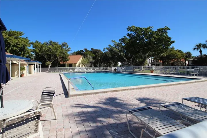 Community pool with a patio area.