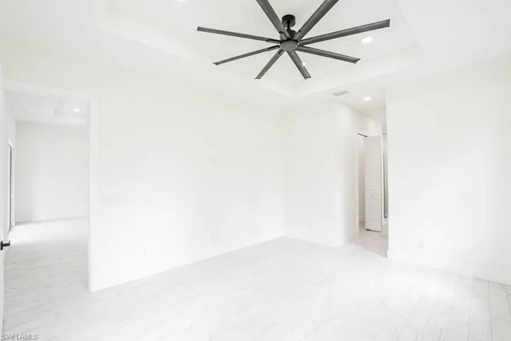 Laundry area featuring light tile patterned flooring and sink