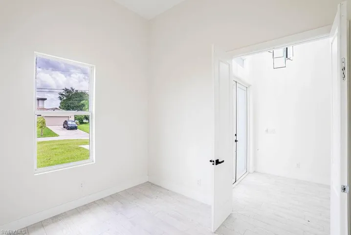 Unfurnished bedroom with ceiling fan, light hardwood / wood-style flooring, and a closet