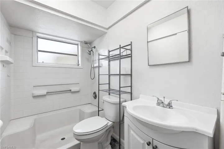 Full bath featuring vanity and a shower