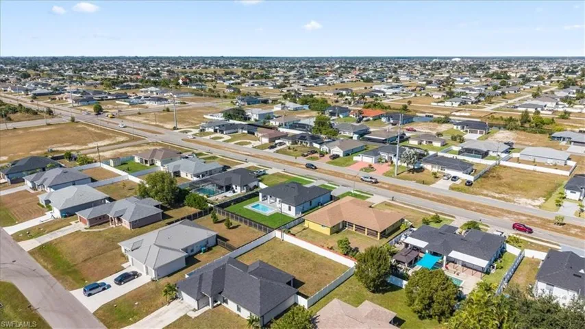 Aerial overview of property's location with nearby suburban area