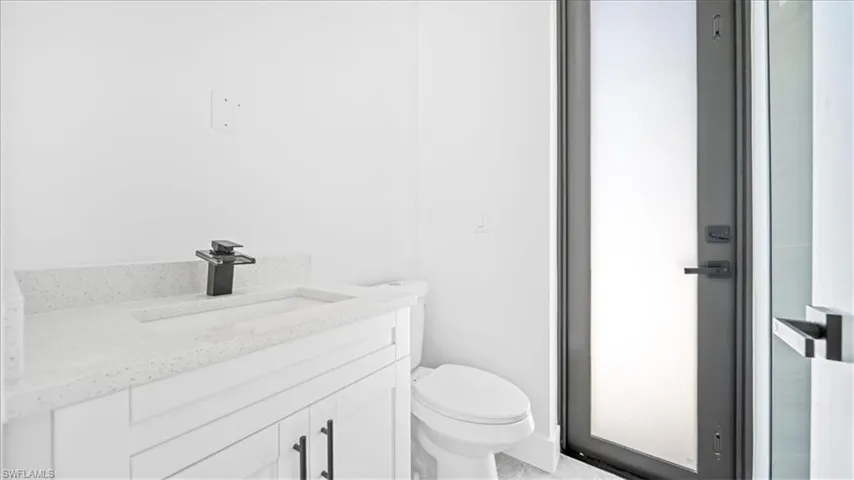 Bathroom with vanity and toilet