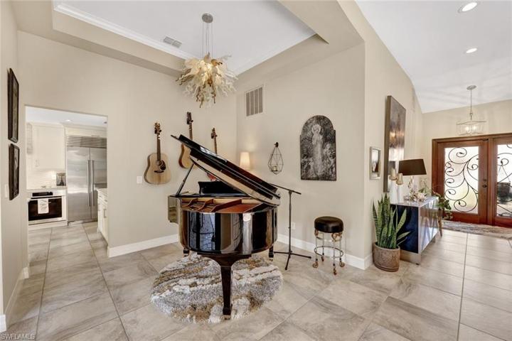 Dining space being used for a grand piano.