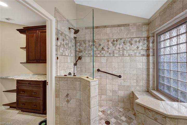 Additional storage cabinets in the water closet.