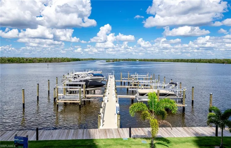 Dock with boat lift and a water view