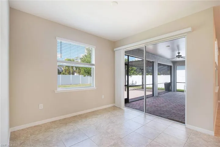 Dining Area with a window and light tile  floors