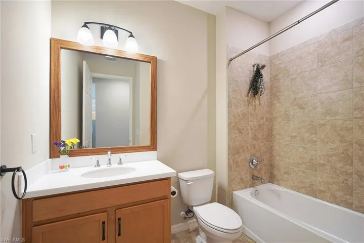 Bathroom featuring vanity and shower / tub combination