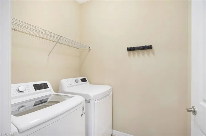 Laundry area featuring washer and clothes dryer
