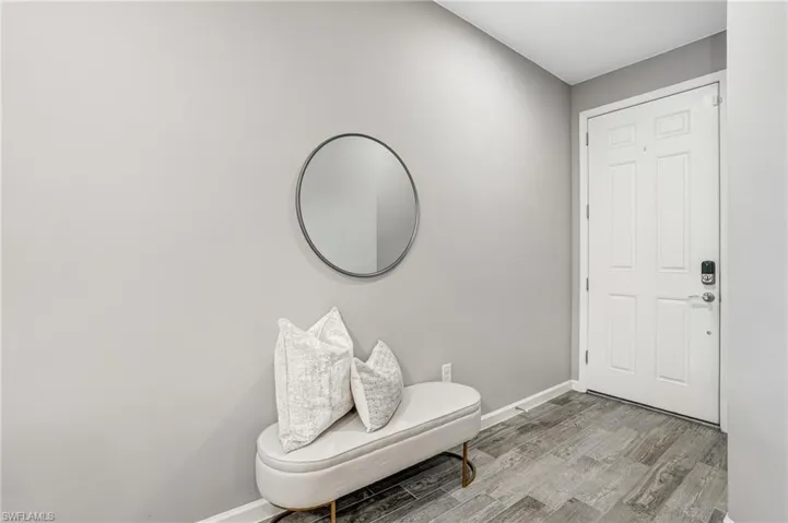 Entryway featuring light wood-style flooring and baseboards
