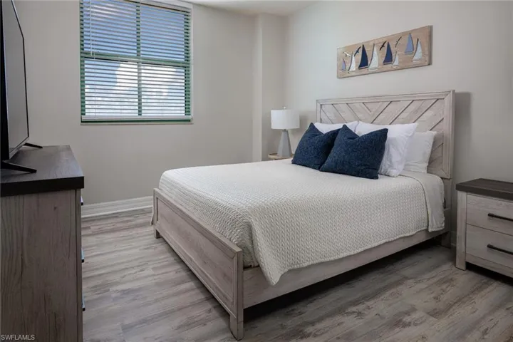 Bedroom featuring light wood-style floors and baseboards