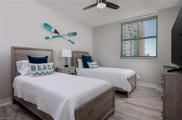 Bedroom with light wood-type flooring and ceiling fan