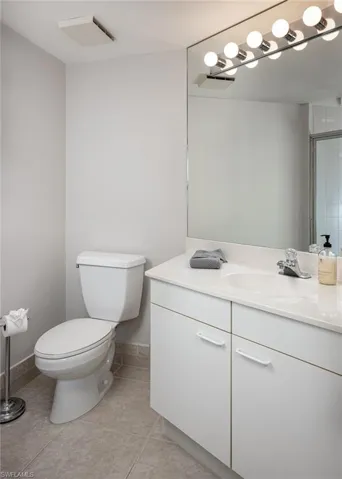 Bathroom with vanity and light tile patterned floors